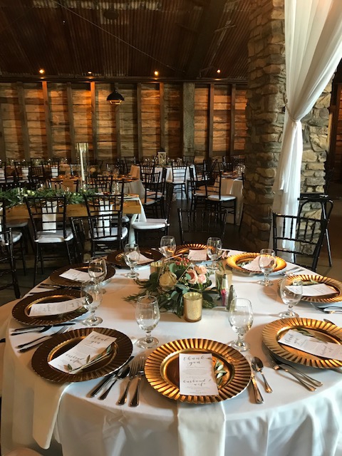 A Spectacular Dinner set with plate chargers by Catering By Norris
